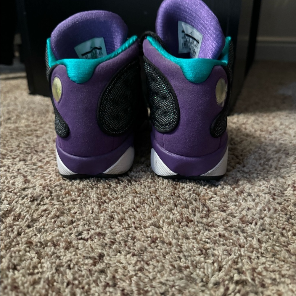 Air Jordan 13 Retros in a black, purple, and teal colorway - Picture 7 of 9